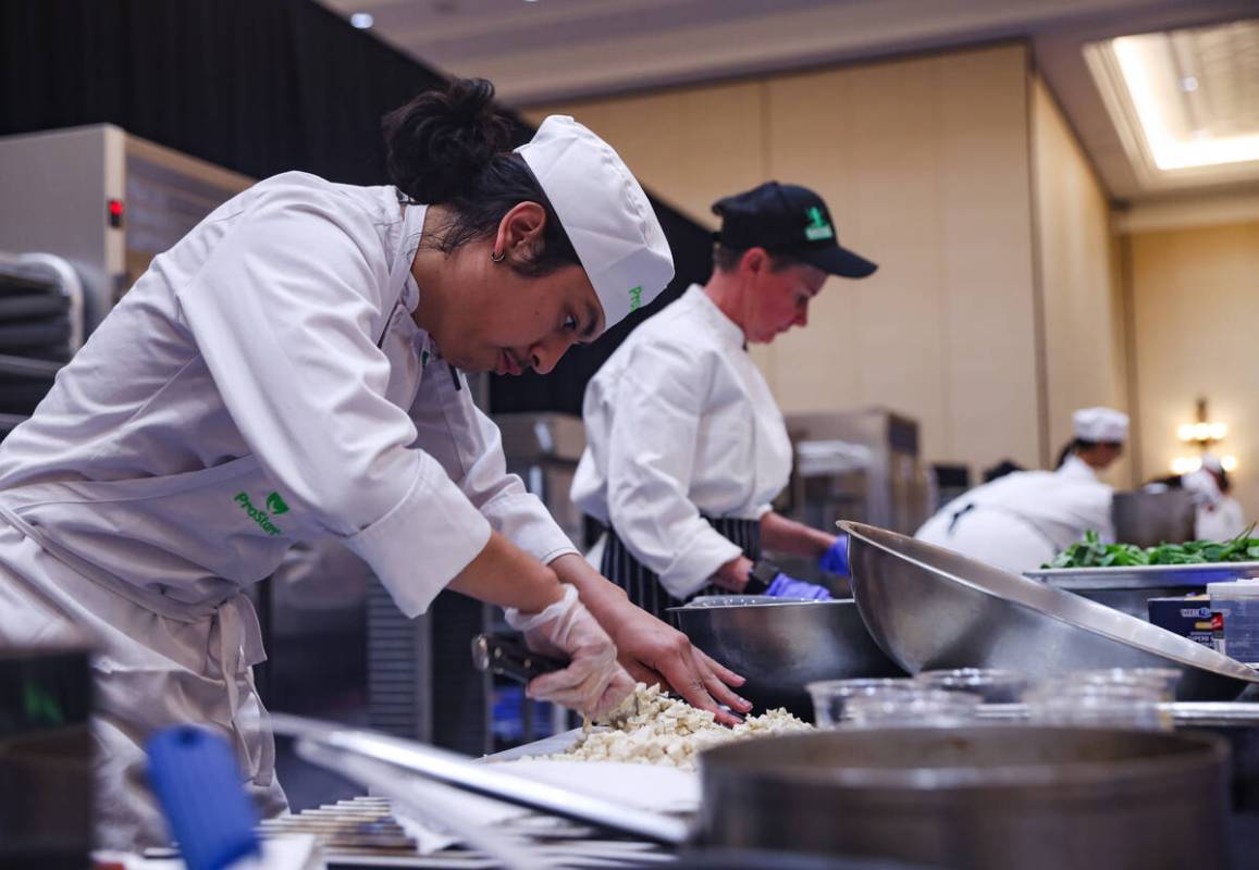 Prinz Villagracia, 17, from Rancho High School, competes in the School Meal Cooking Challenge a ...