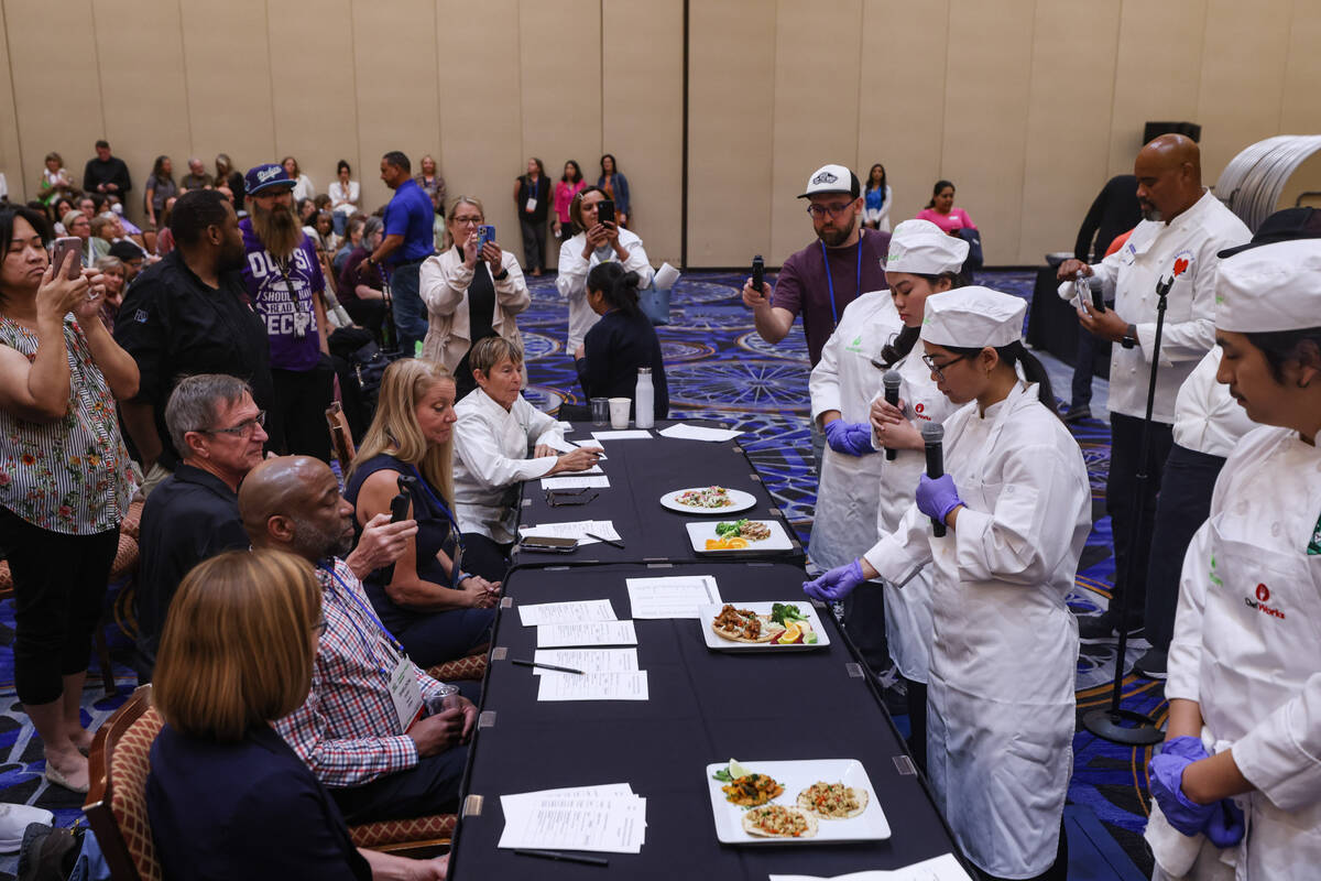 Nicole Patague, 16, from Silverado High School, describes her meal to the judges at the School ...