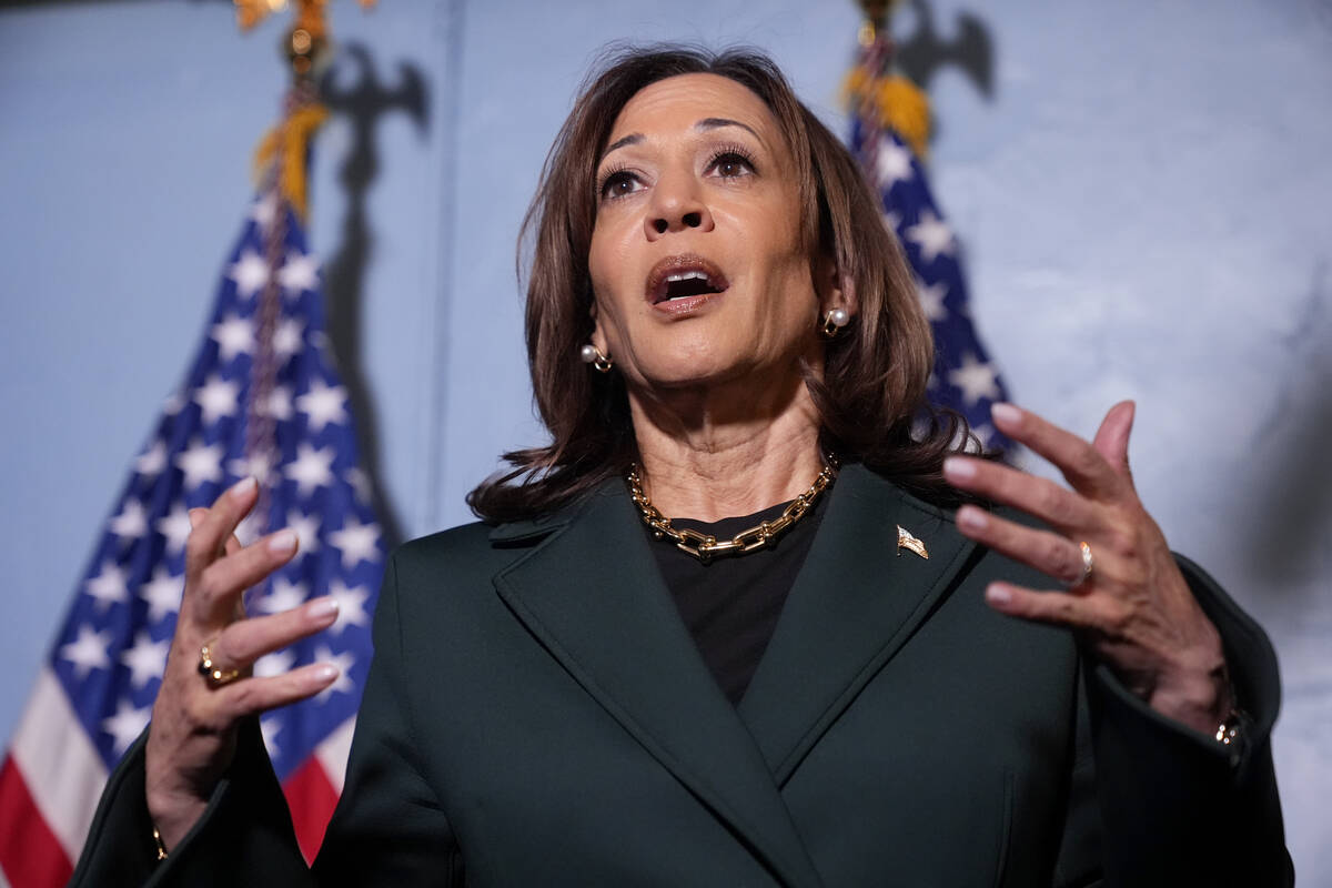 Democratic presidential nominee Vice President Kamala Harris speaks with reporters before a tow ...