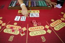 Soon Lee practices dealing baccarat at the CEG Dealer School in Las Vegas, Thursday, April 1, 2 ...