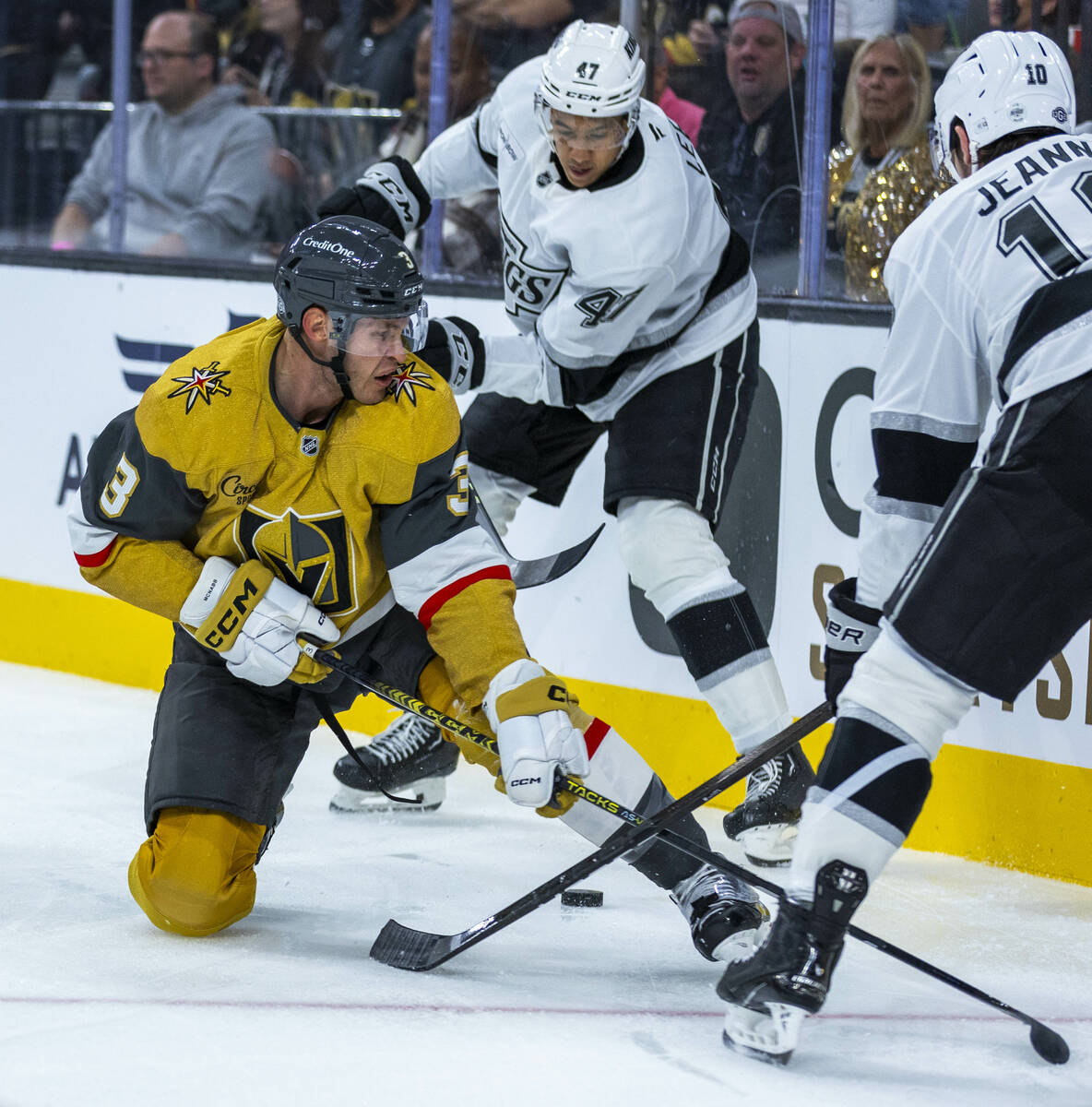 Golden Knights defenseman Brayden McNabb (3) goes to a knee while pursuing the puck against Los ...