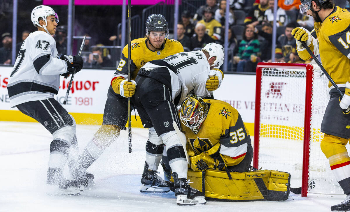 Golden Knights goaltender Ilya Samsonov (35) secures another puck as Los Angeles Kings center T ...