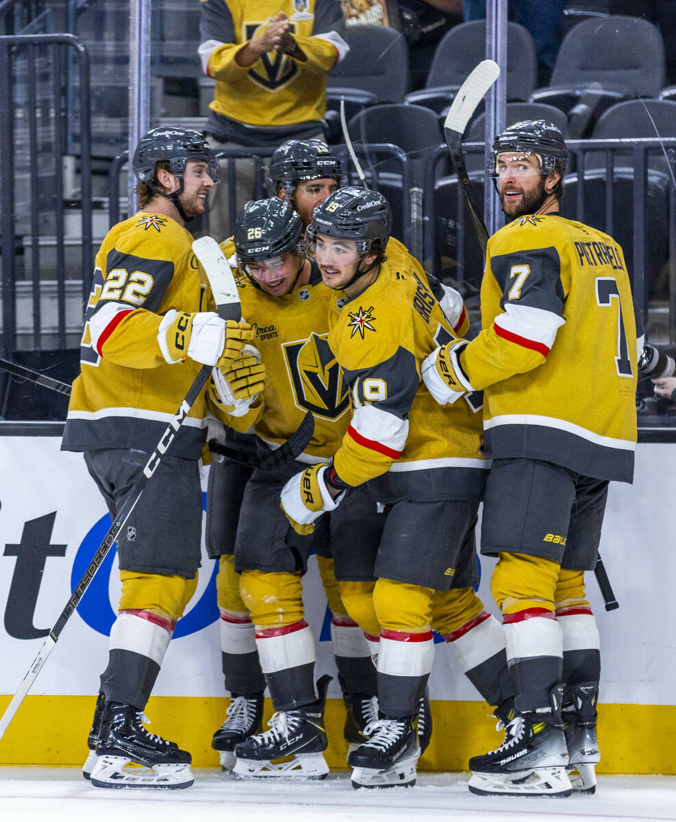 Golden Knights players celebrate another goal against the Los Angeles Kings during the third pe ...