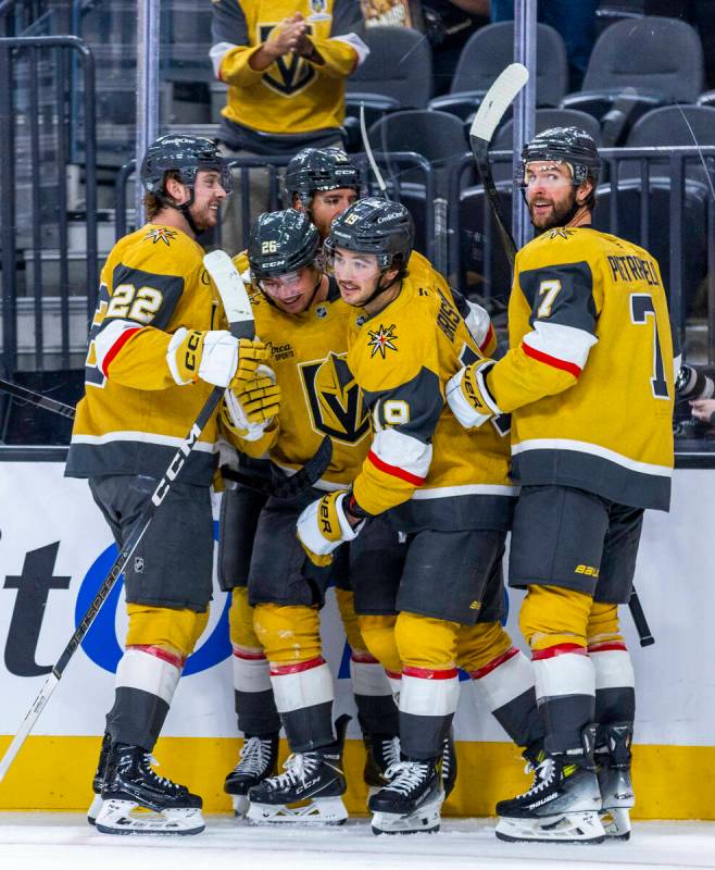 Golden Knights players celebrate another goal against the Los Angeles Kings during the third pe ...