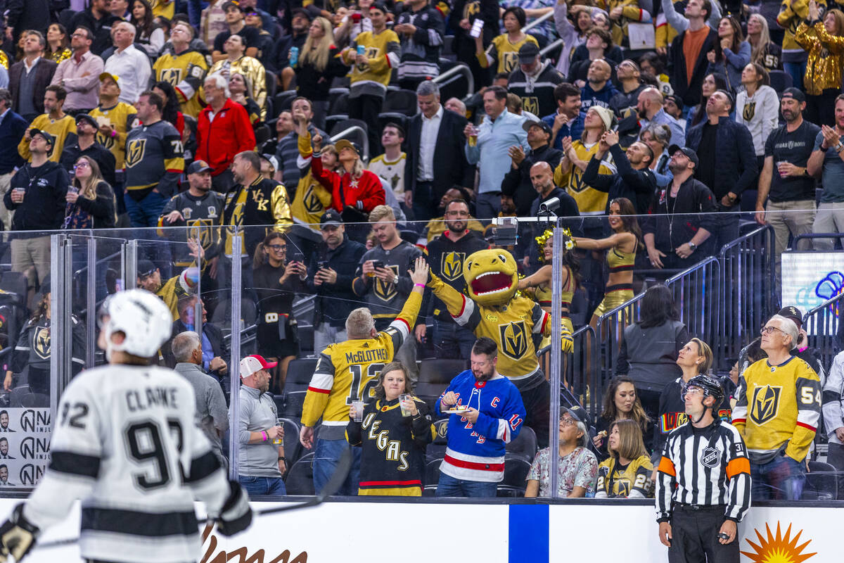 Golden Knights fanscelebrate another goal against the Los Angeles Kings during the third period ...