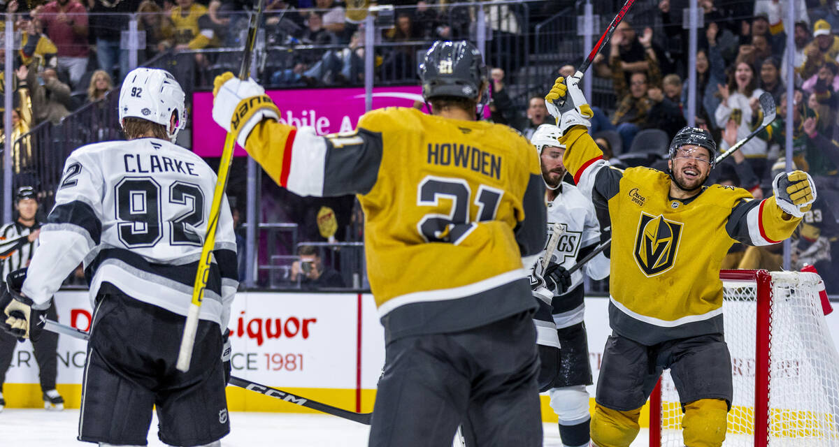 Golden Knights center Tomas Hertl (48) celebrates with center Brett Howden (21) after sneaking ...