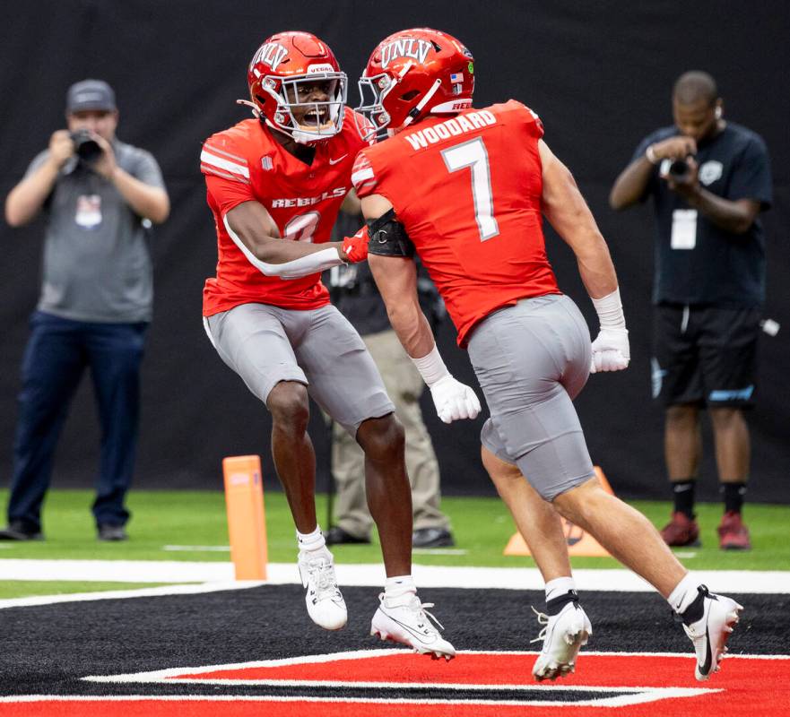 UNLV linebacker Jackson Woodard (7) celebrates with defensive back Tony Grimes (0) after sackin ...