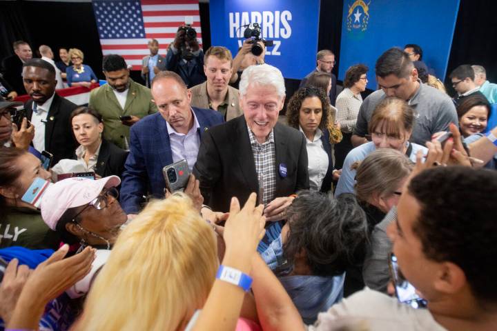 Former President Bill Clinton greets attendees after speaking during a Harris-Walz campaign sto ...