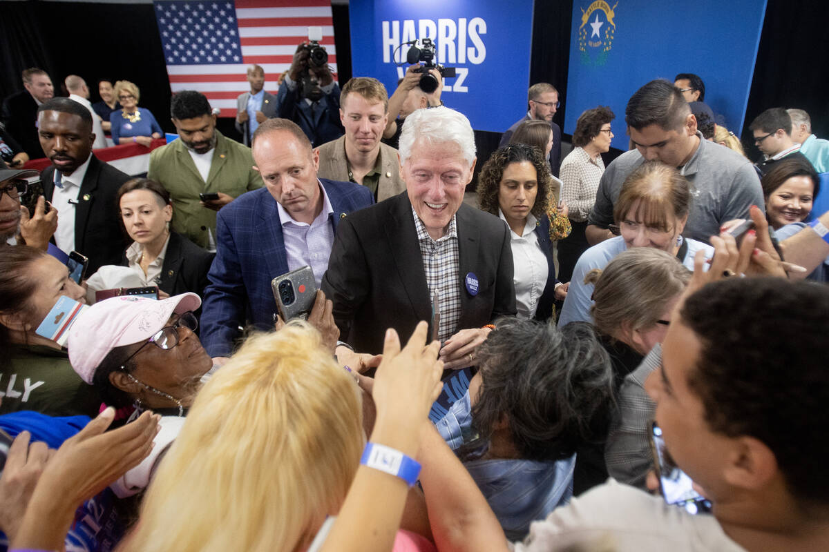 Former President Bill Clinton greets attendees after speaking during a Harris-Walz campaign sto ...