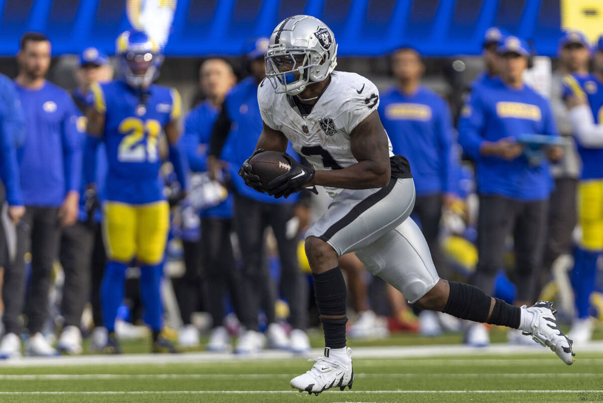 Raiders running back Zamir White (3) rushes with the football during the second half of an NFL ...