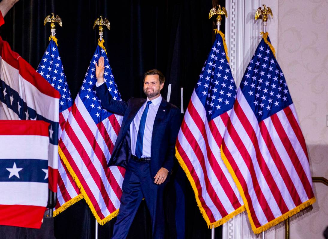 Republican vice presidential nominee Sen. JD Vance arrives on stage to speak to supporters at T ...