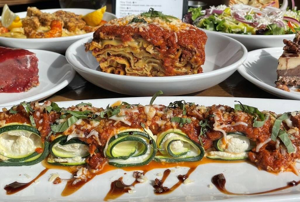 A stuffed zucchini roll, front, and lasagna, center, from Tarantino's Vegan, a family-owned veg ...