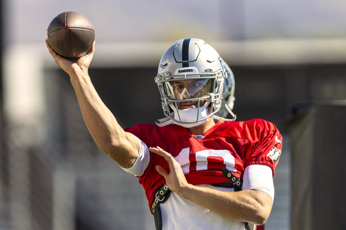 Raiders quarterback Desmond Ridder (10) prepares to throw the football during team practice at ...