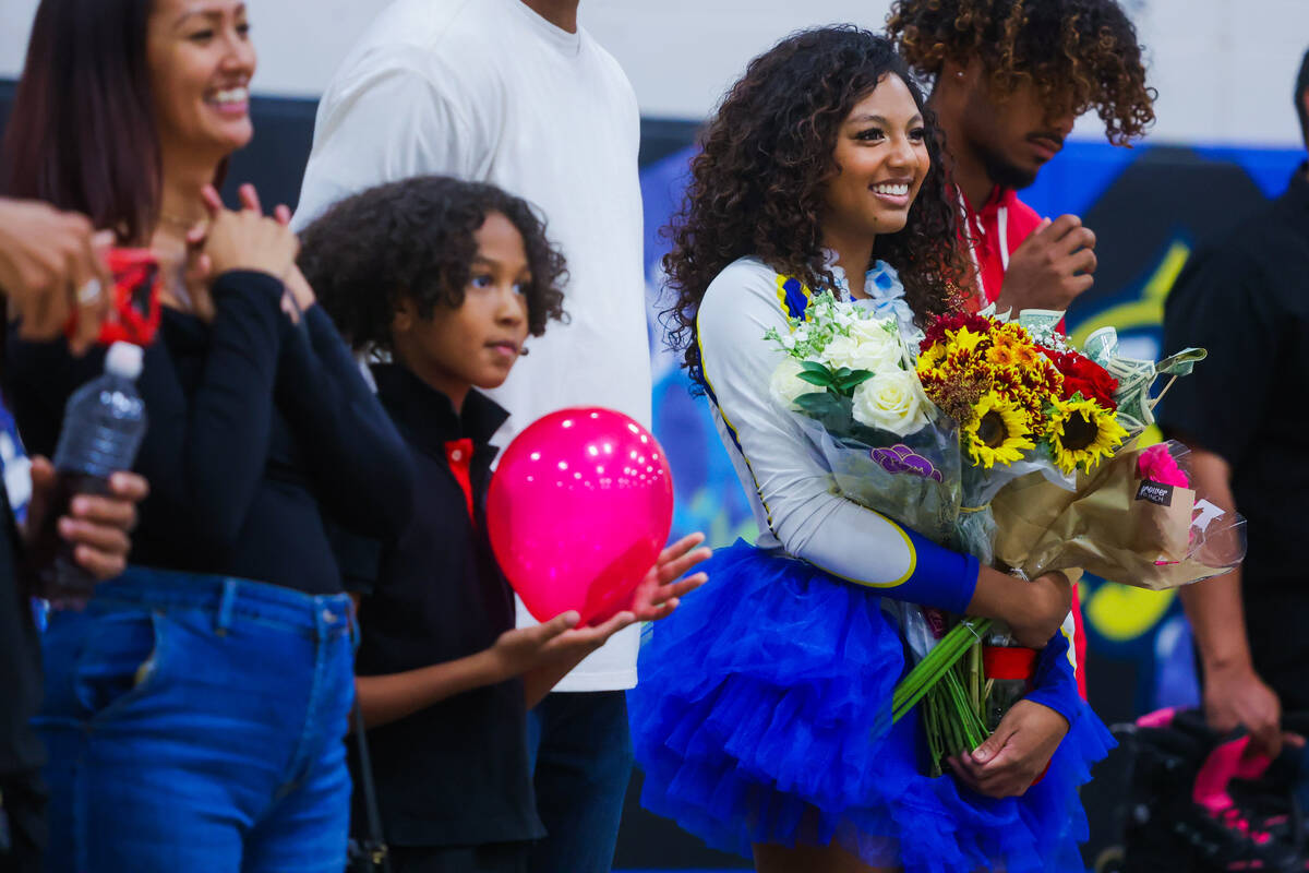 Sierra Vista senior Araeya Pearson holds flowers during senior night before a volleyball match ...