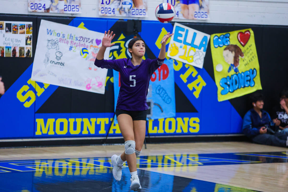 Durango opposite hitter Maya Dominguez sets the ball during a volleyball match between Durango ...