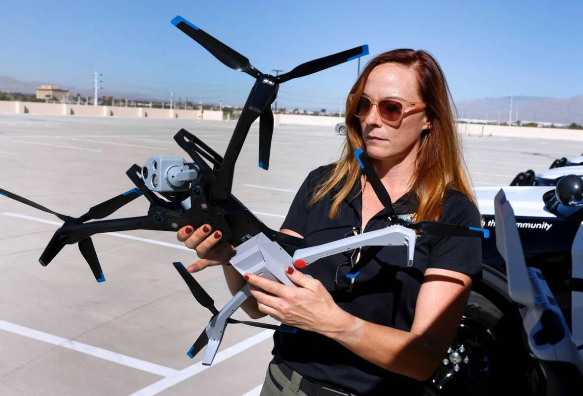 Mary Movius, a civilian drone operator, displays a Skydio X10 during a drone demonstration for ...