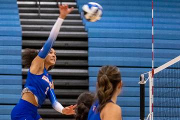 Bishop Gorman junior Ayanna Watson (8) spikes the ball during the volleyball match against Foot ...