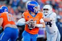 Boise State quarterback Maddux Madsen (4) looks down field against Utah State in the first half ...