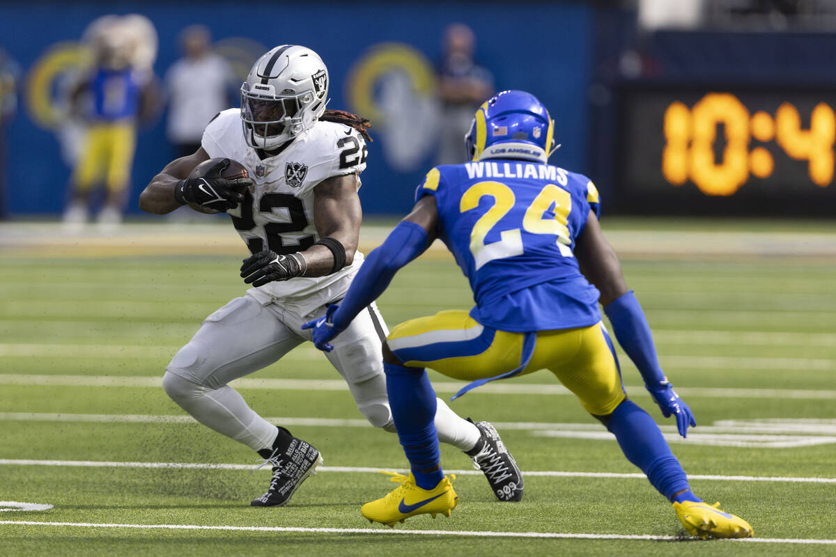 Los Angeles Rams cornerback Darious Williams (24) looks to tackle Raiders running back Alexande ...