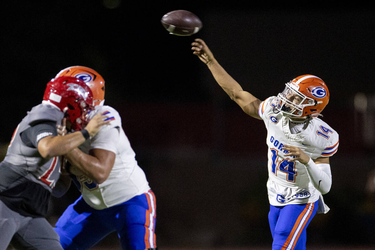 Bishop Gorman quarterback Maika Eugenio (14) throws the ball during the high school football ga ...