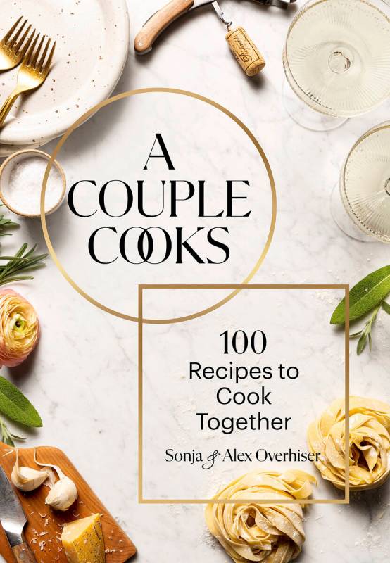 This cover image released by Chronicle Books shows "A Couple Cooks: 100 Recipes to Cook To ...