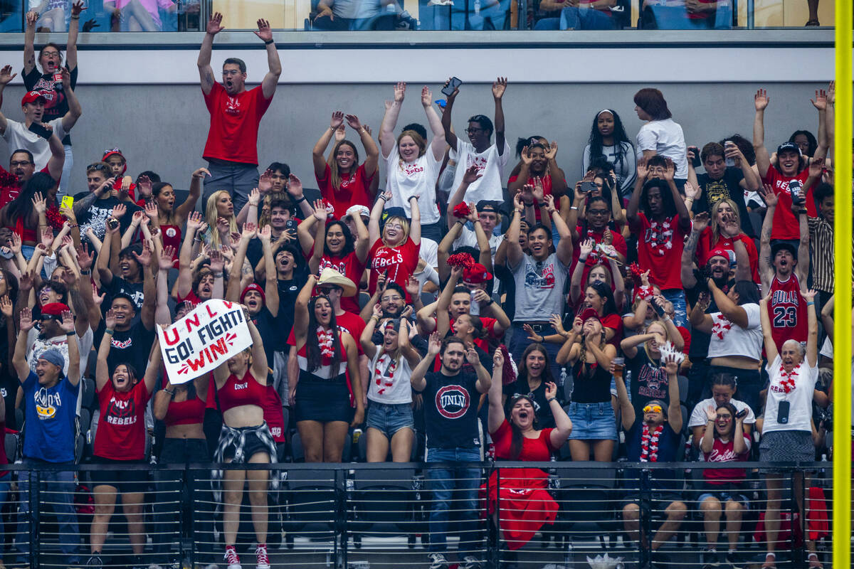 UNLV fans cheer as they blow out Fresno State Bulldogs during the second half of their NCAA foo ...