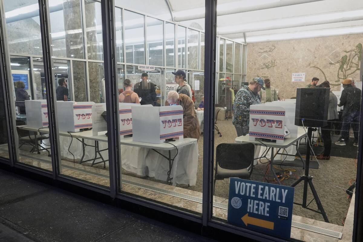 Voters cast their ballots at the Frank P. Zeidler Municipal Building during the first day of Wi ...