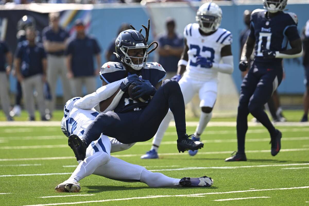 Tennessee Titans' DeAndre Hopkins (10) makes a catch against Indianapolis Colts' Jaylon Jones ( ...