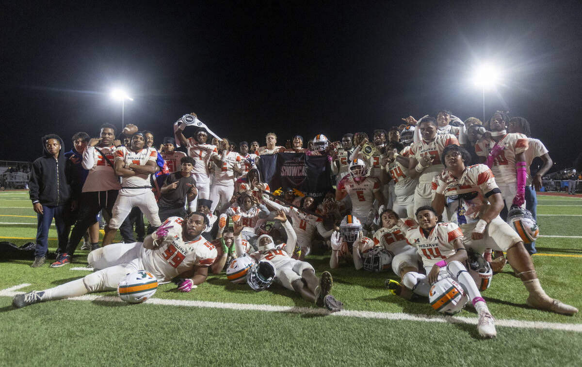 Mojave celebrates the 32-21 win over Losee after the high school 4A Desert League title footbal ...