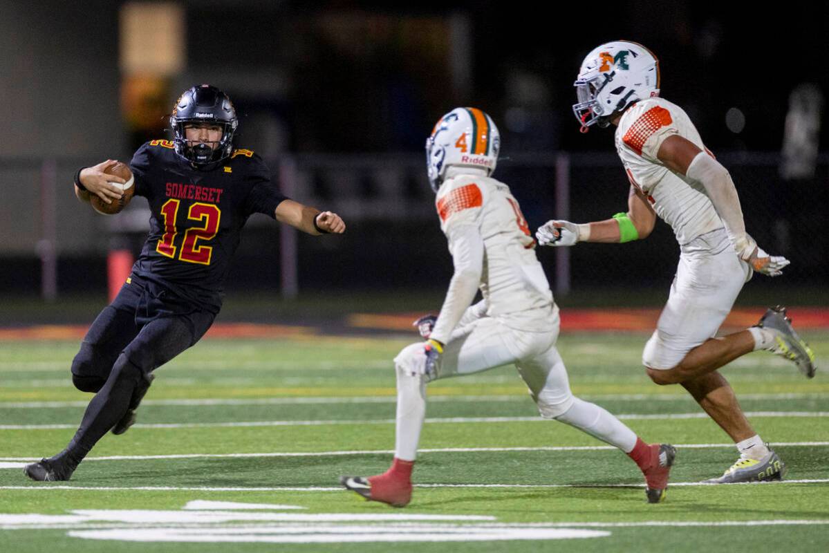 Losee senior RJ Olivieri (12) begins to slide during the high school 4A Desert League title foo ...