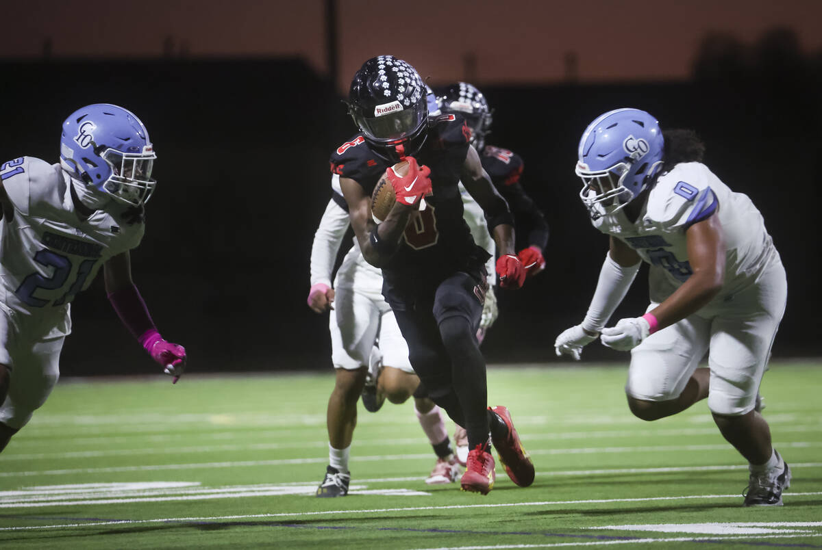 Las Vegas' Mychael Walker (6) runs the ball against Centennial during a football game at Las Ve ...