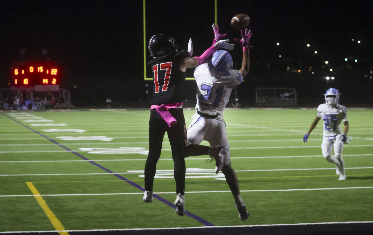 Centennial's cornerback Domonique Vaughn (21) intercepts a pass intended for Las Vegas' wide re ...