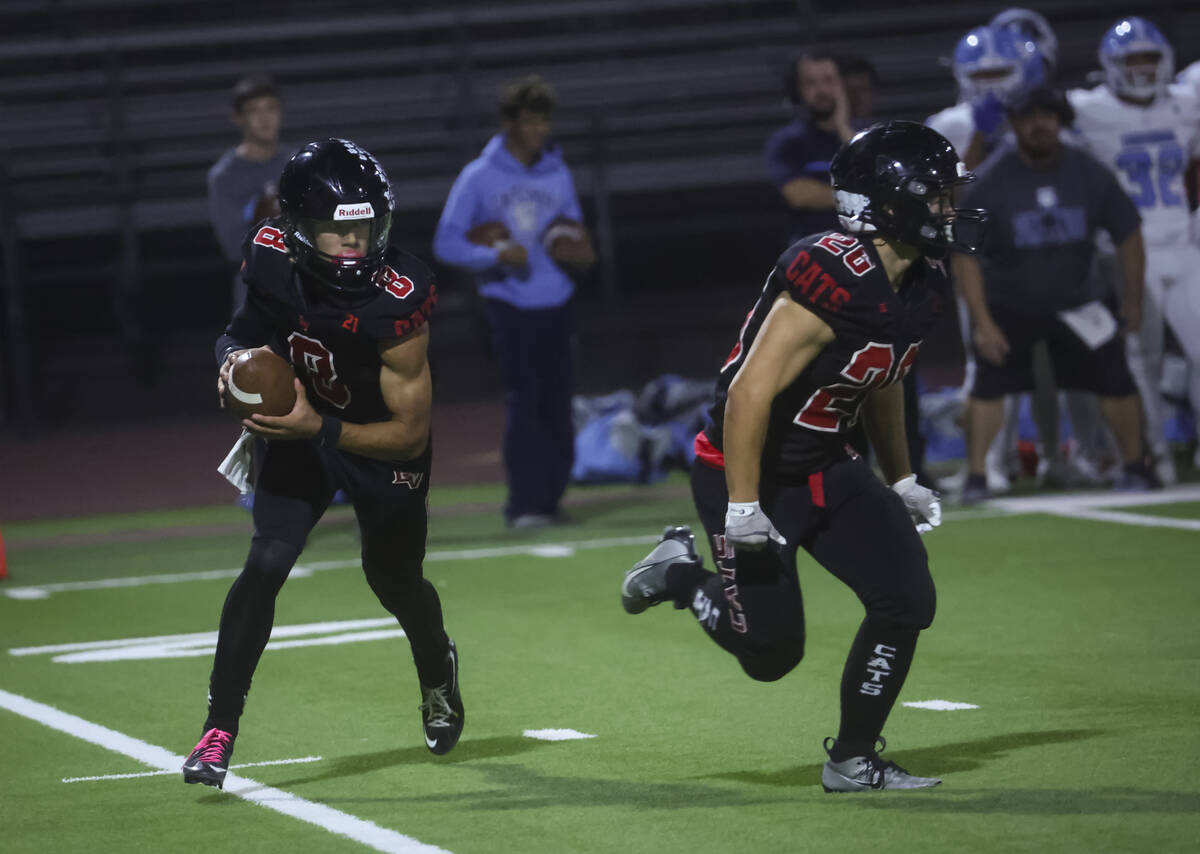 Las Vegas quarterback Tanner Vibabul (8) looks to pass the ball during a football game against ...