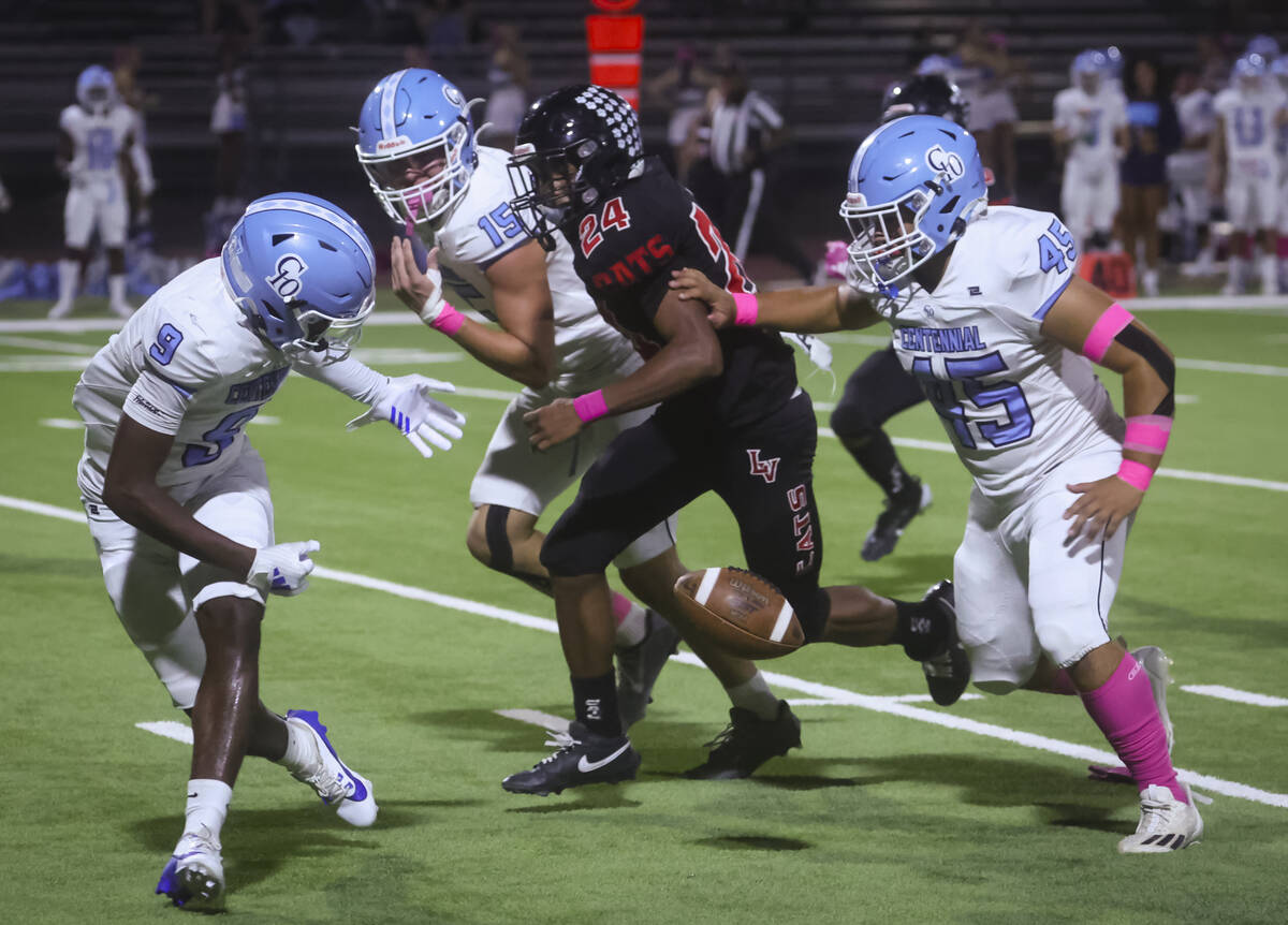 Centennial's Jhbari Christmas (9) fumbles the ball in front of Las Vegas' Andre Weigum (24) dur ...