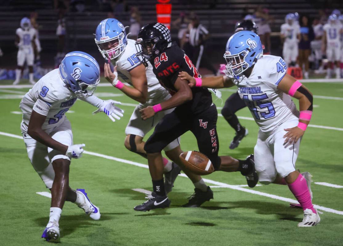 Centennial's Jhbari Christmas (9) fumbles the ball in front of Las Vegas' Andre Weigum (24) dur ...