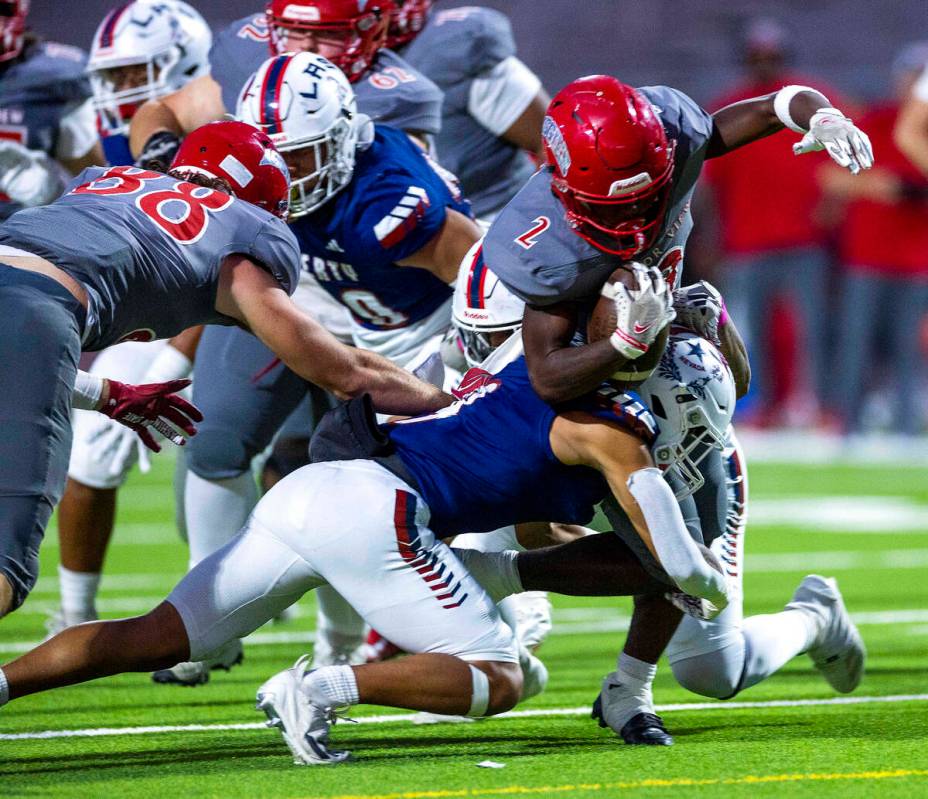 Arbor View's running back Sean Moore (2) battles for yards against Liberty during the first hal ...