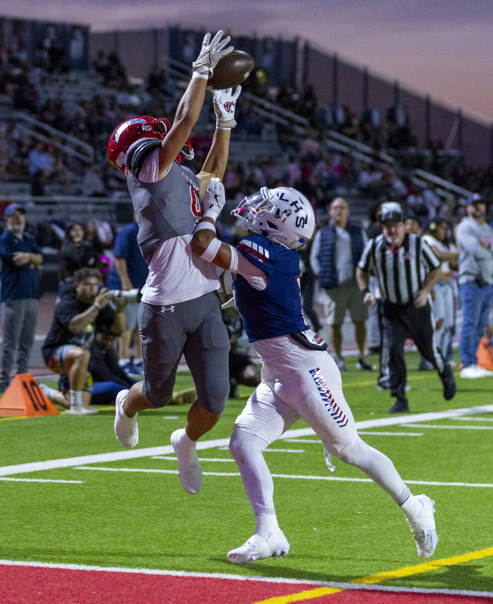 Arbor View's wide receiver Kai Cypher (9) elevates for a touchdown catch attempt as Liberty def ...