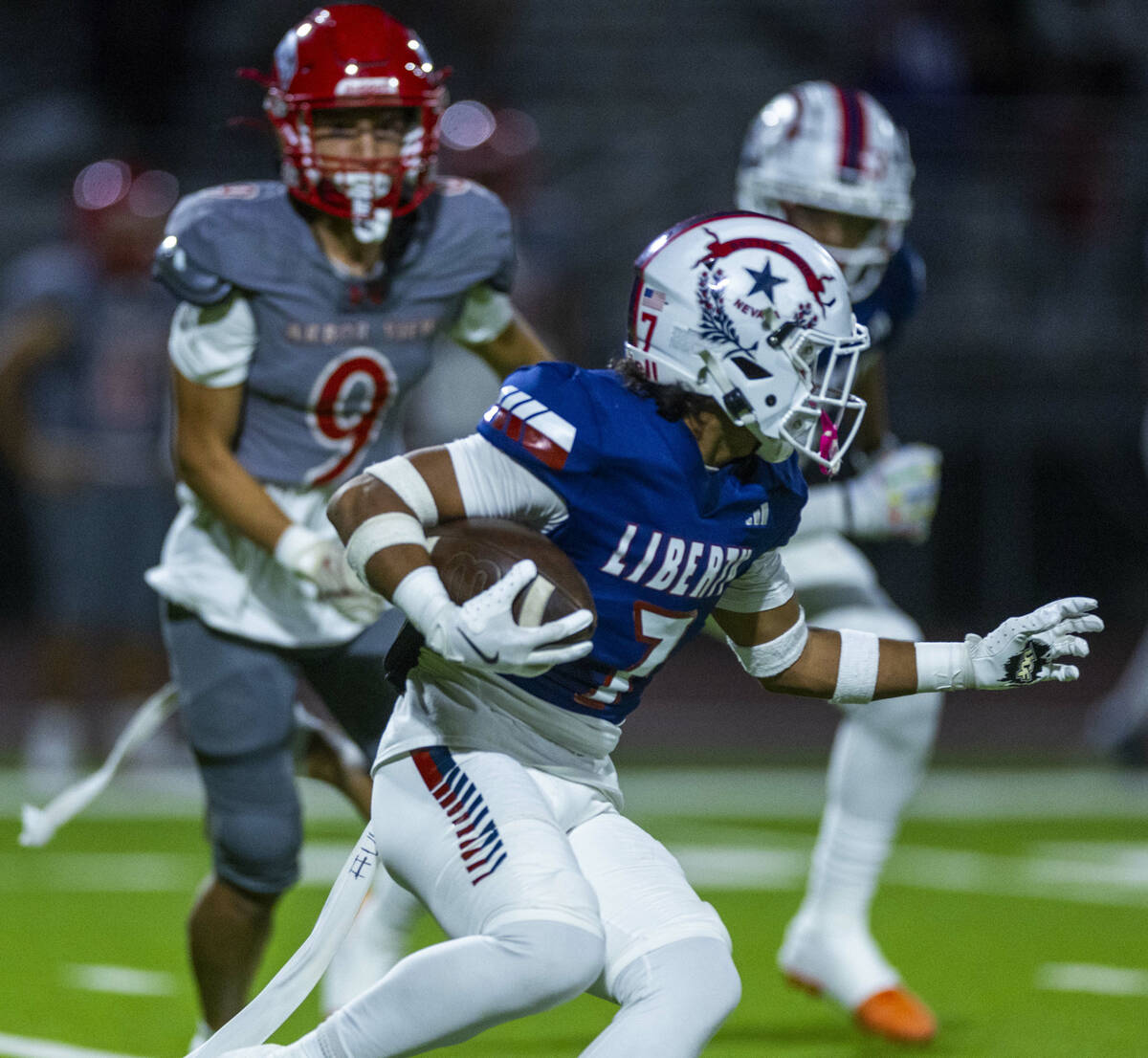 Liberty defender Gravis Lopez (7) runs back an interception against Arbor View during the first ...