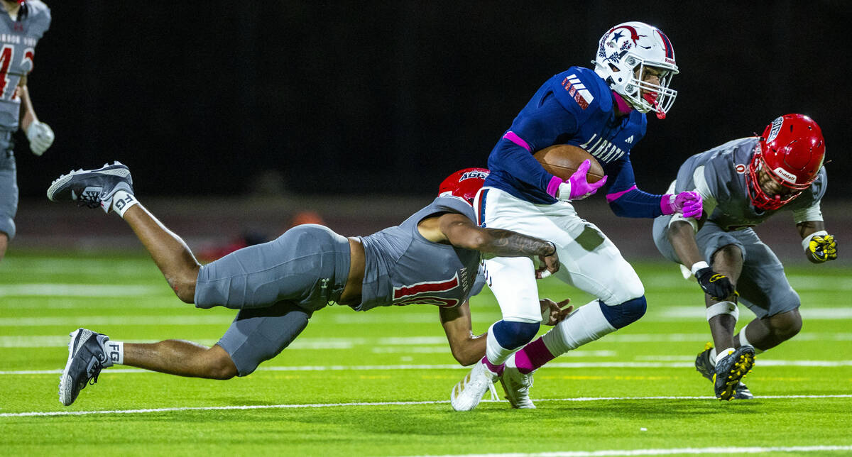 Arbor View defensive back Braylen Gardner (10) pulls down Liberty wide receiver Treven Edingto ...