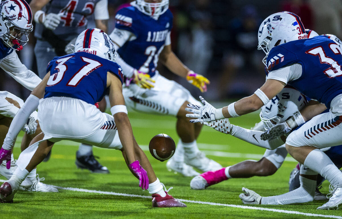 Liberty players attempt to secure an on side kick against Arbor View which failed to go 10 yard ...