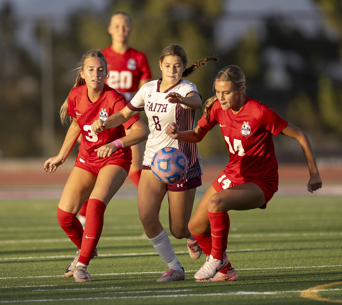 Coronado midfielder Alexandra Milano (3), Faith Lutheran forward Olivia Stark (8) and Coronado ...