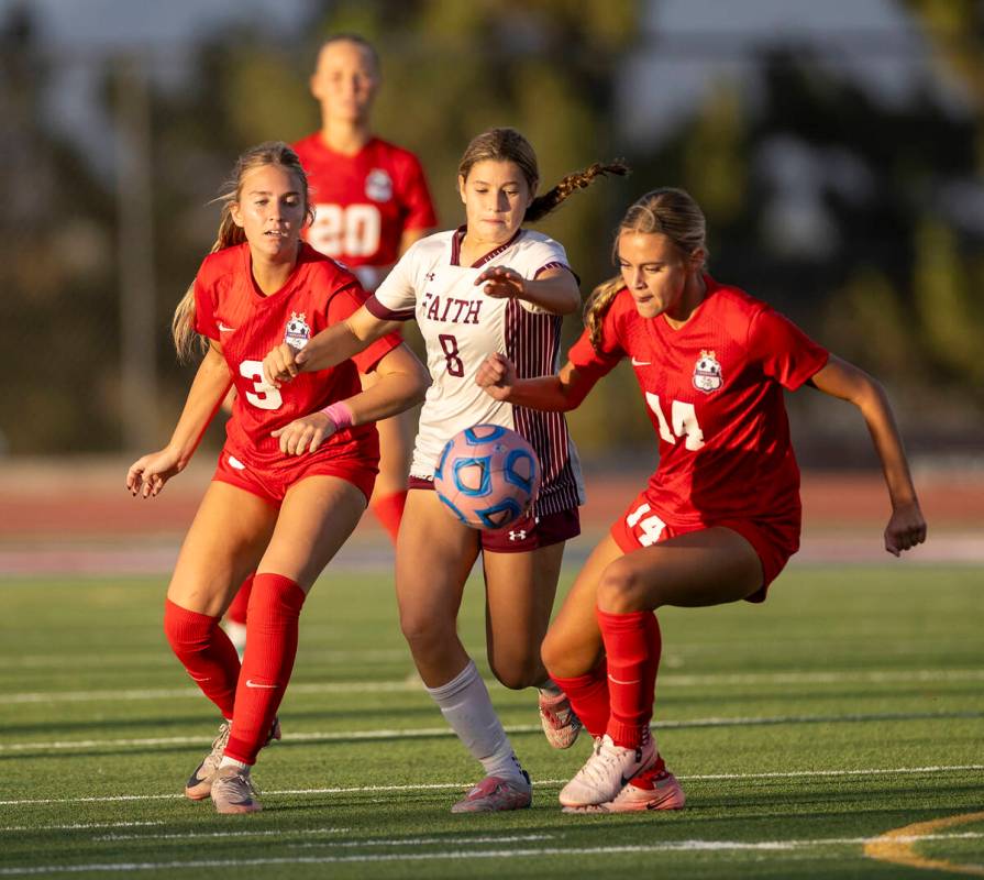 Coronado midfielder Alexandra Milano (3), Faith Lutheran forward Olivia Stark (8) and Coronado ...