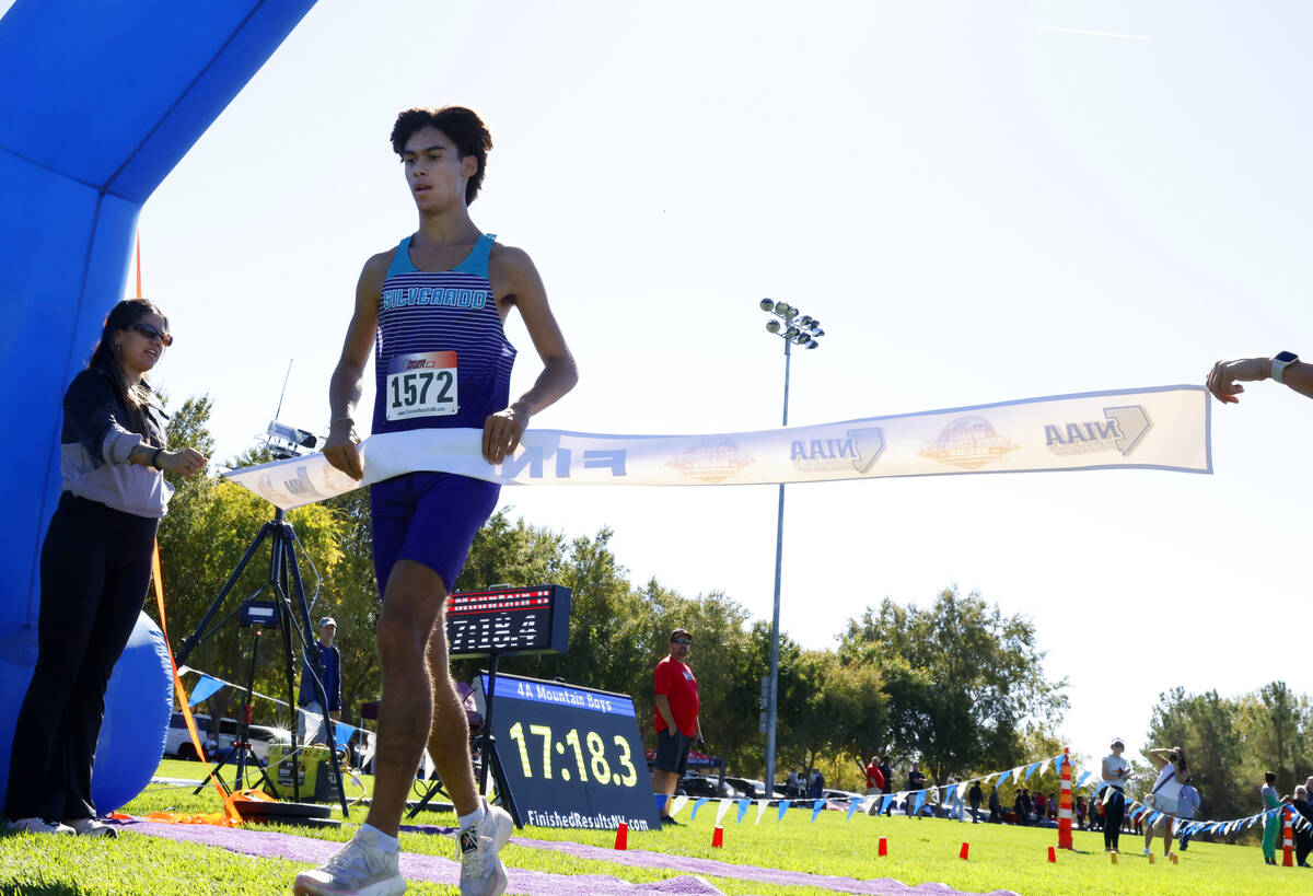 Myles Oliver of Silverado crosses the finish line during the 4A Mountain boys cross country mee ...