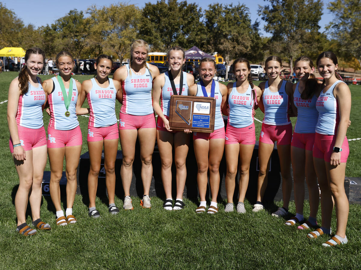 Shadow Ridge High School runners pose for a photo after winning the 5A Southern Region girls cr ...