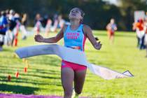 Elynn Okuda of Shadow Ridge crosses the finish line during the 5A Southern girls cross country ...