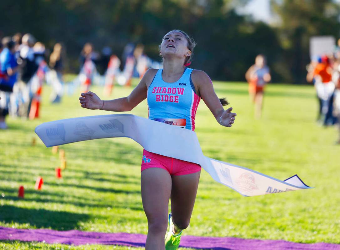 Elynn Okuda of Shadow Ridge crosses the finish line during the 5A Southern girls cross country ...