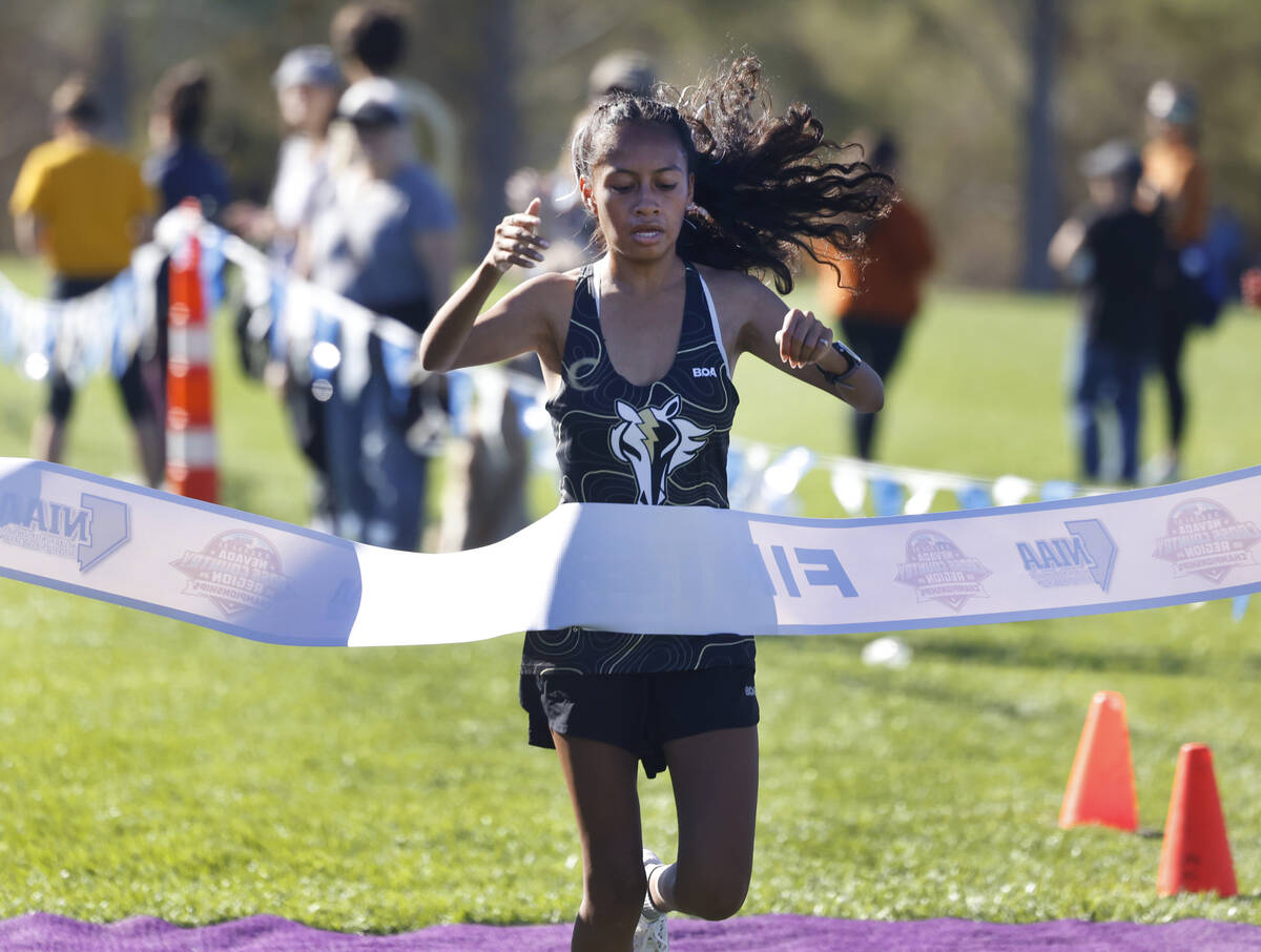 Vianey Toledo of Clark High crosses the finish line during the 4A Mountain girls cross country ...