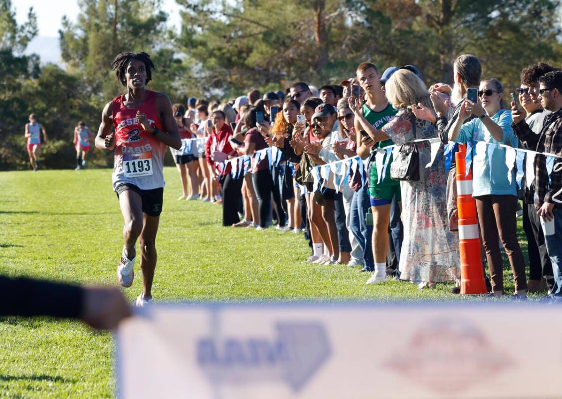 Kenan Dagge of Desert Oasis approaches the finish line during the 5A Southern boys cross countr ...