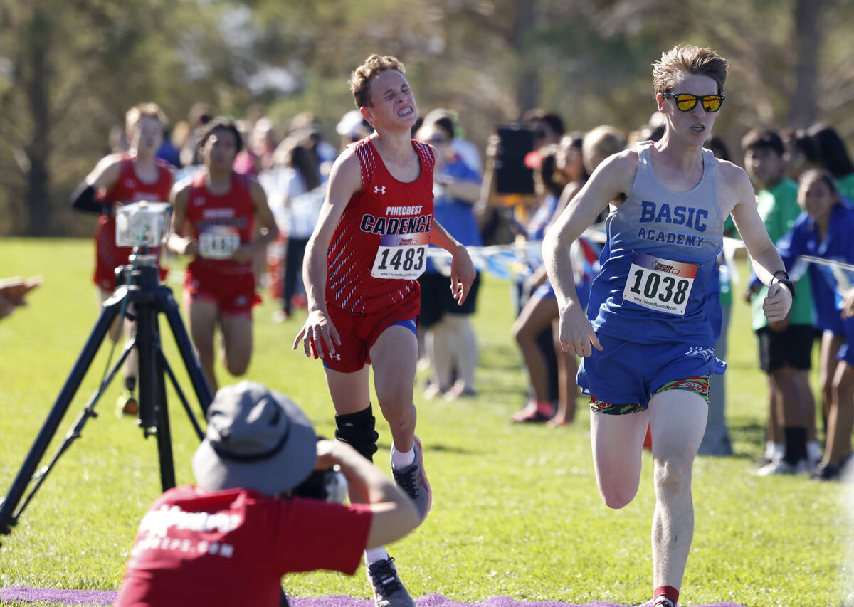 Craig Ross of Basic, right, approaches the finish line ahead of Henry Johnson of Pinecrest Acad ...