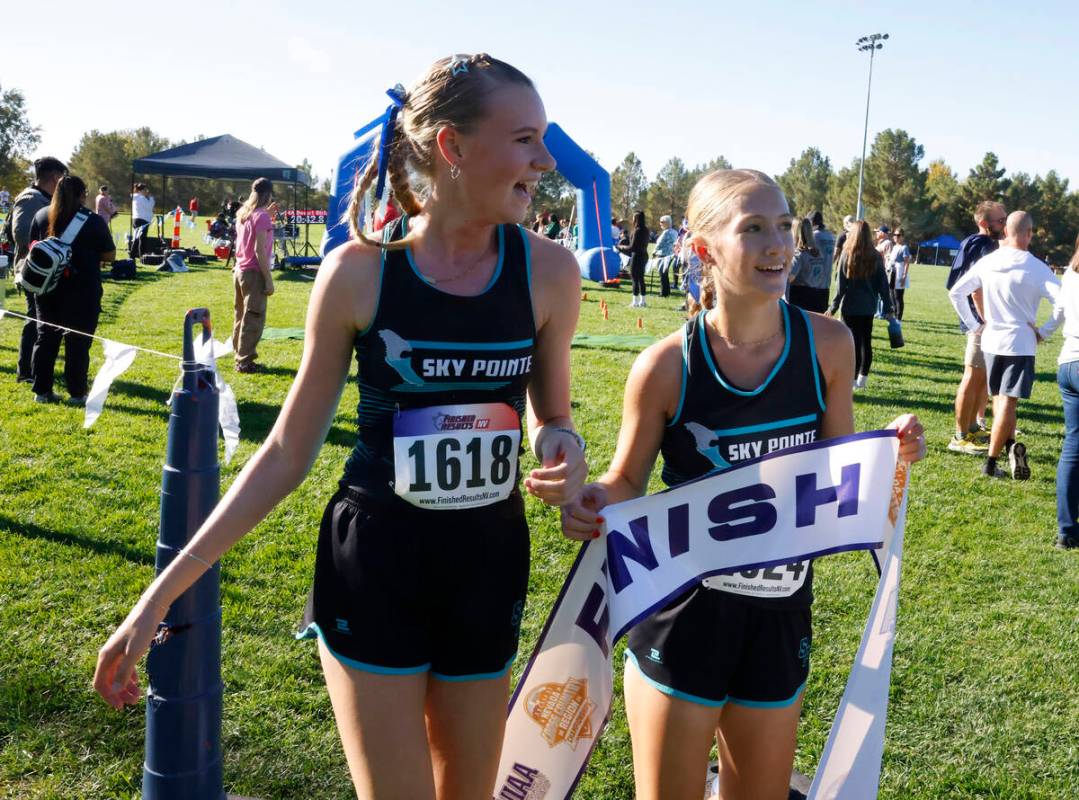 Mackenzie Teel, right, and Ella Christensen, both of Somerset Academy Sky Pointe, celebrate aft ...